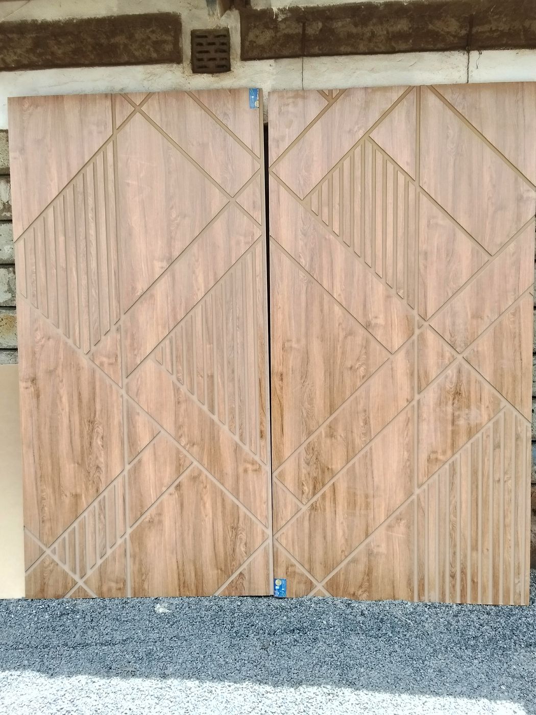 Wood-grain doors with CNC-cut diagonal grooves
