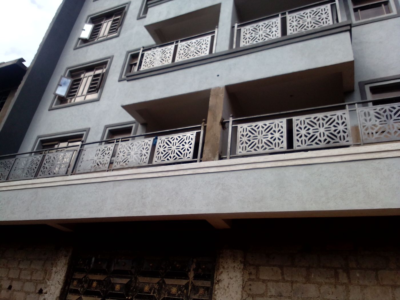 CNC-cut jali panels on building balconies
